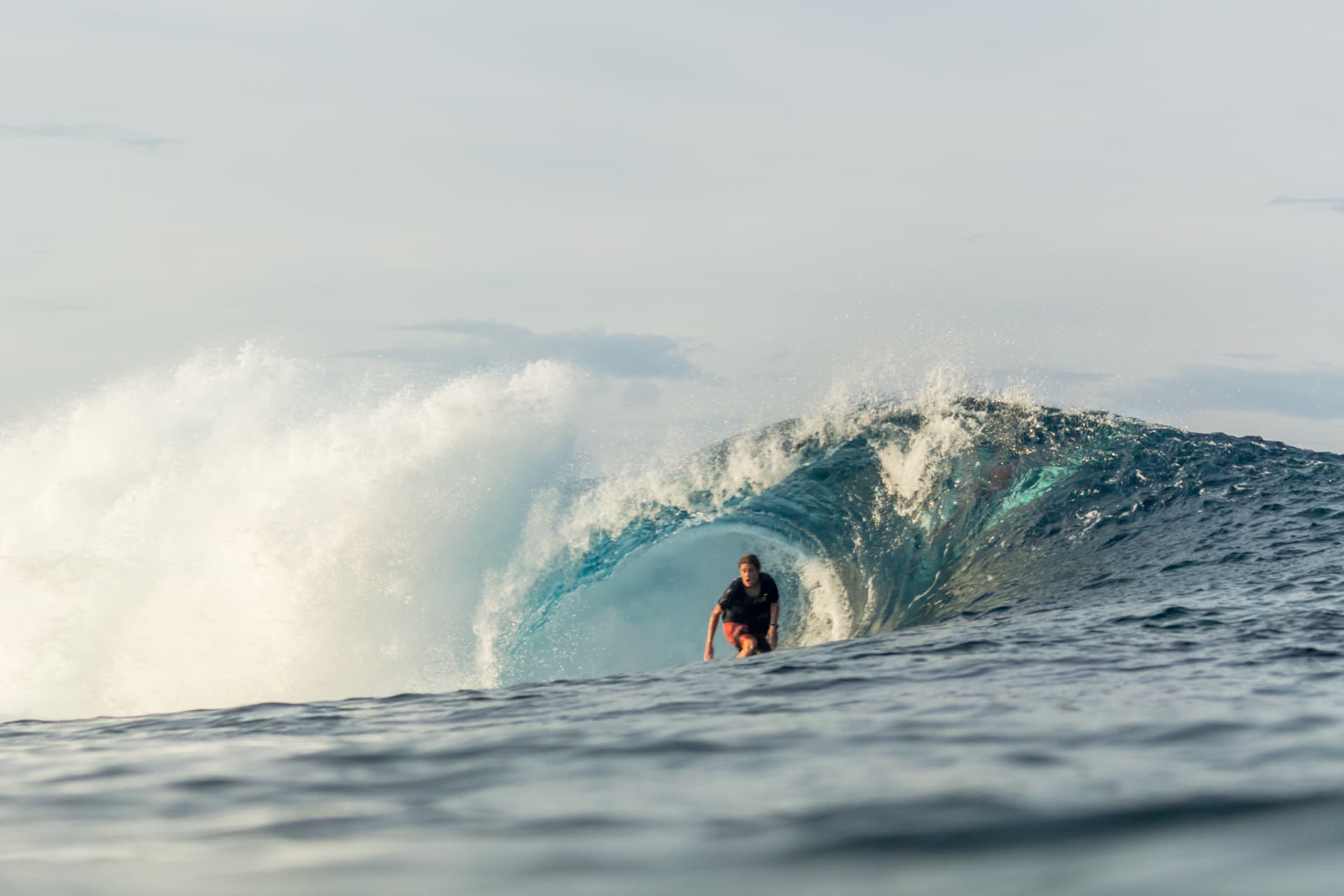 Surfer getting barelled at Tuason in Siargao, Philippines.