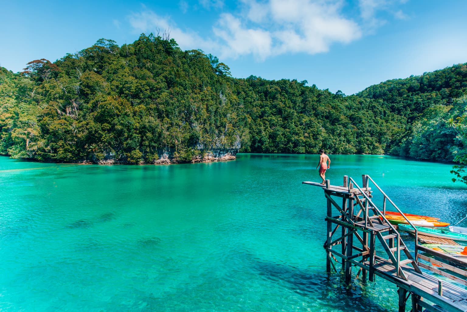 Sugba Lagoon turquoise water and wooden boardwalk in Siargao Island Philippines